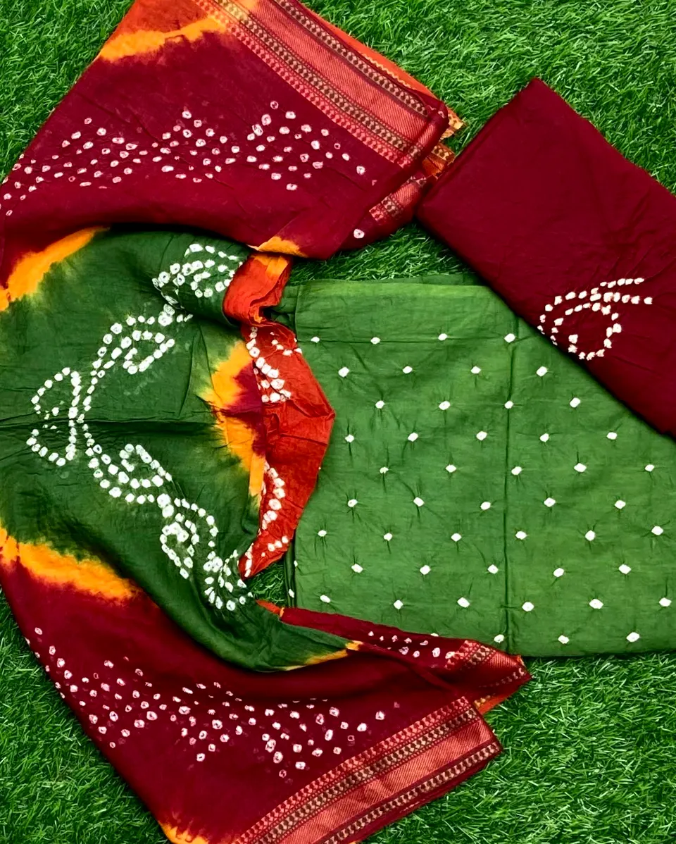 Tie-dyed suit pieces in deep green and maroon, dotted with white and finished with a woven border