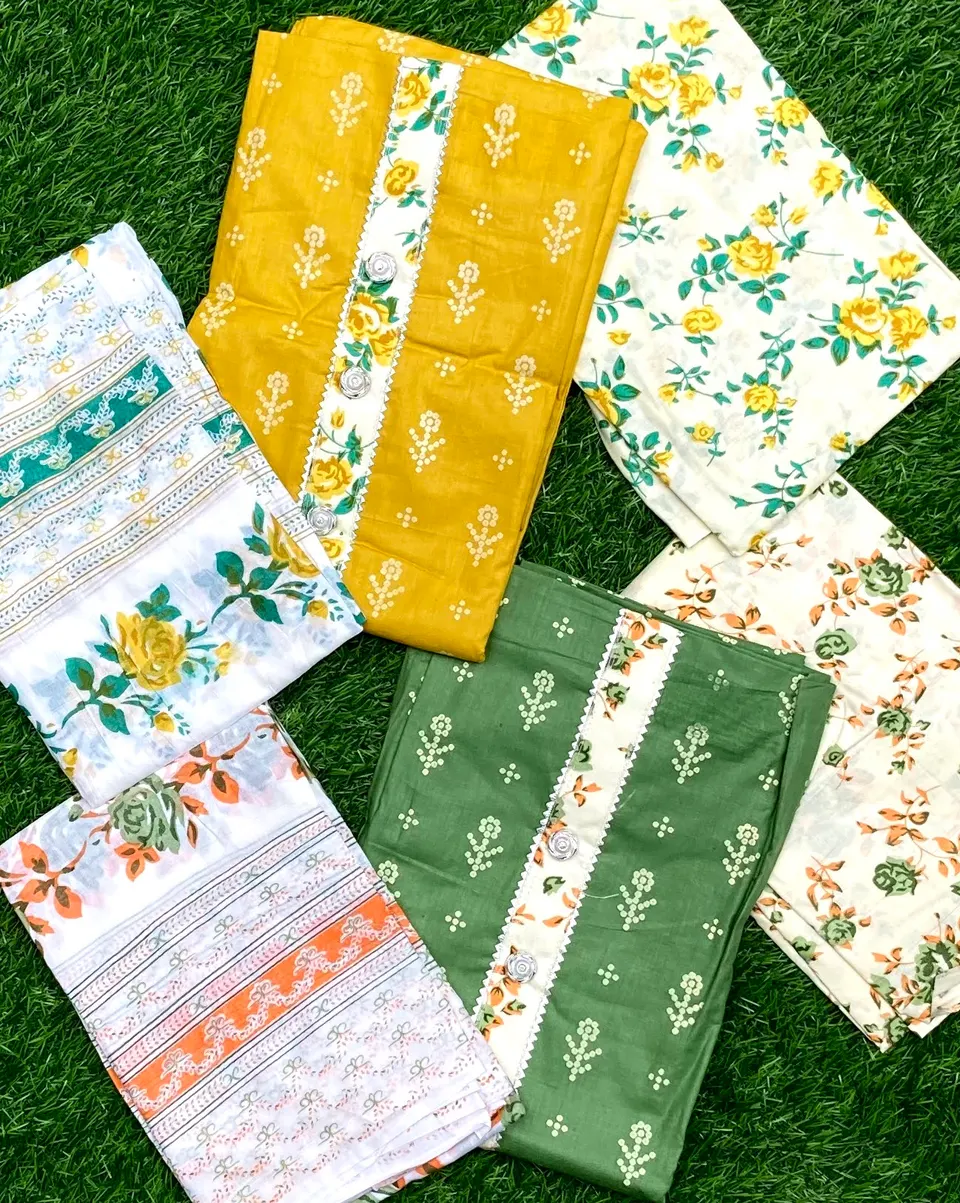 An assortment of floral printed cotton suit pieces in yellow, green, cream and white