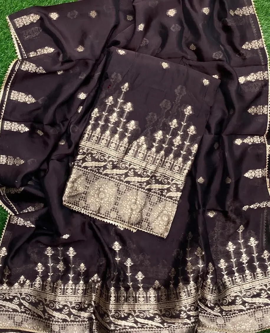 Deep navy suit piece printed with gold architectural motifs and a broad decorated panel