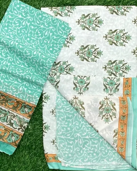 Sea-green and white cotton with a fine floral print and woven border