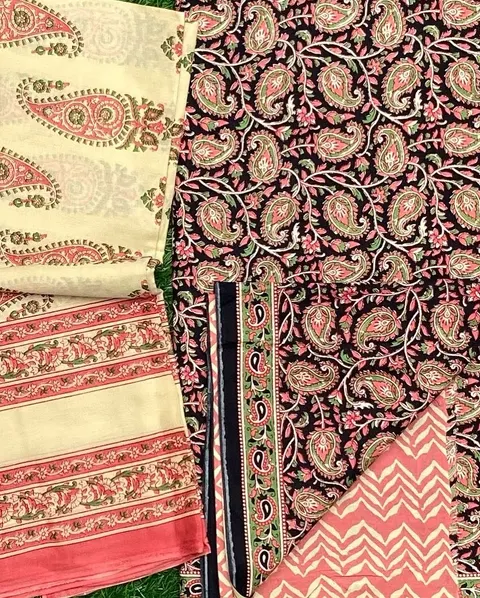 Black and cream cotton in a dense paisley print with a coral border