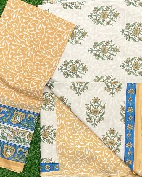 Sand and cream cotton with a delicate sprigged print and blue border